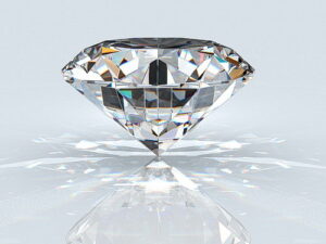 Diamond gem with reflection on blue background