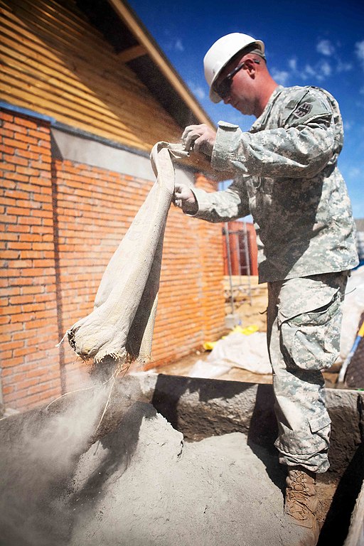 Solider pouring the fine powdery cement